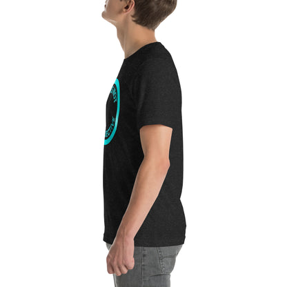 A person in a NeuroNiche Design "OCD Is Not An Adjective" black combed cotton t-shirt with a blue circular design stands in profile, looking upward, wearing gray jeans against a white background.