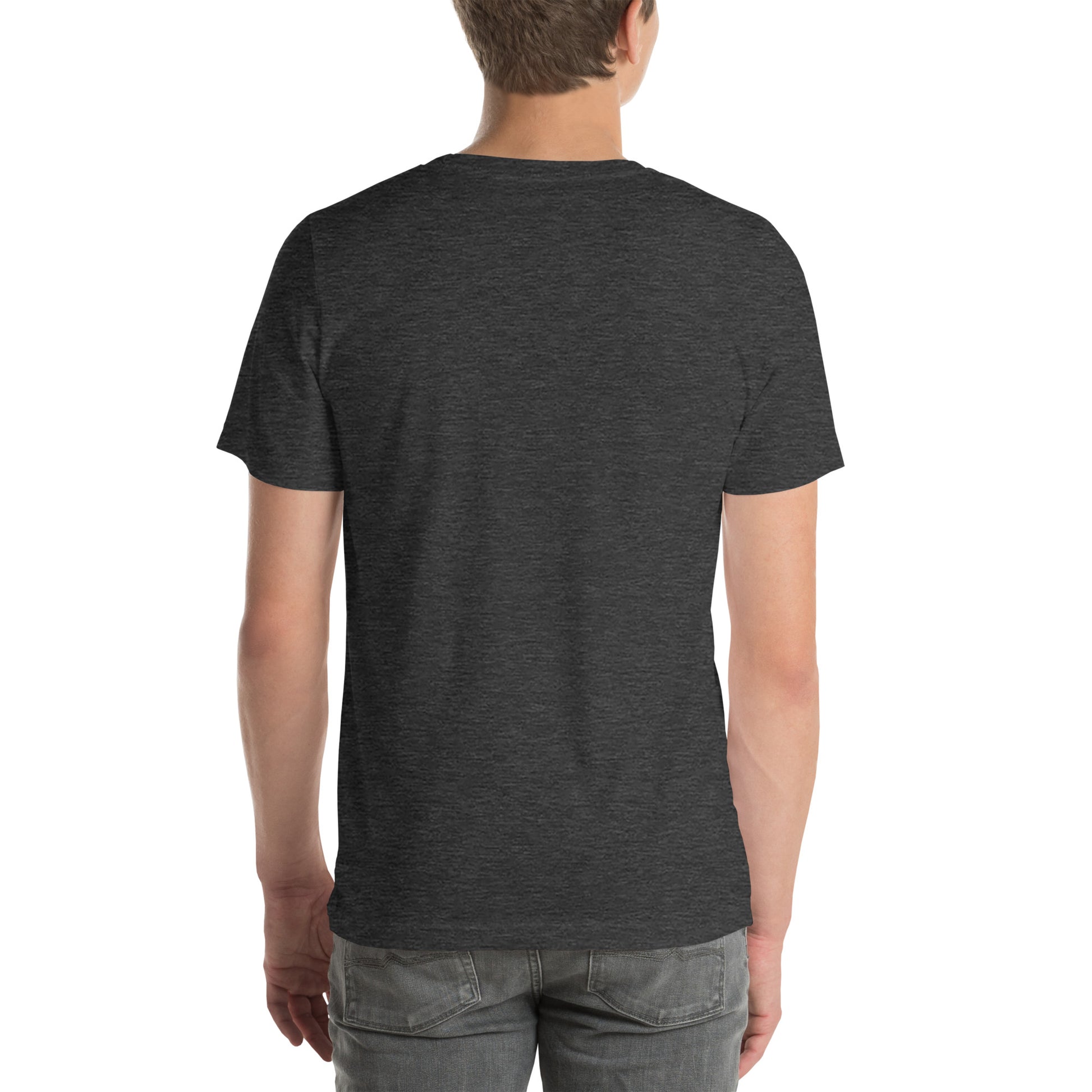 A person with their back to the camera wears a NeuroNiche Design "OCD Is Not An Adjective" t-shirt in plain dark gray combed cotton and light gray jeans. The background is white and uncluttered.