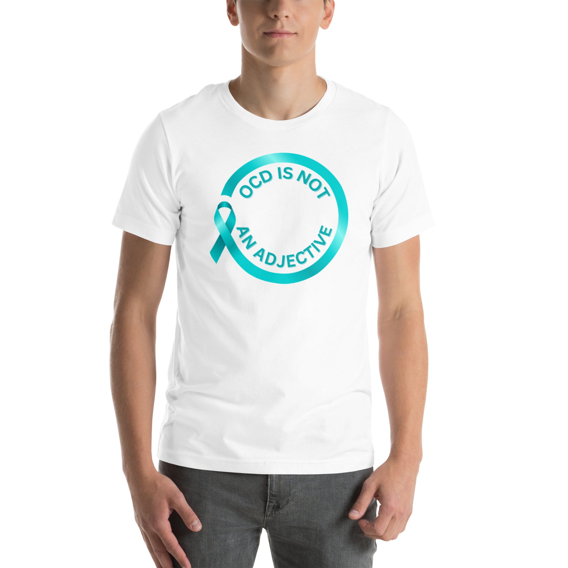 A person wears the "OCD Is Not An Adjective" t-shirt by NeuroNiche Design—a white, combed cotton tee with a teal awareness ribbon and the slogan inside a teal circle on the chest.