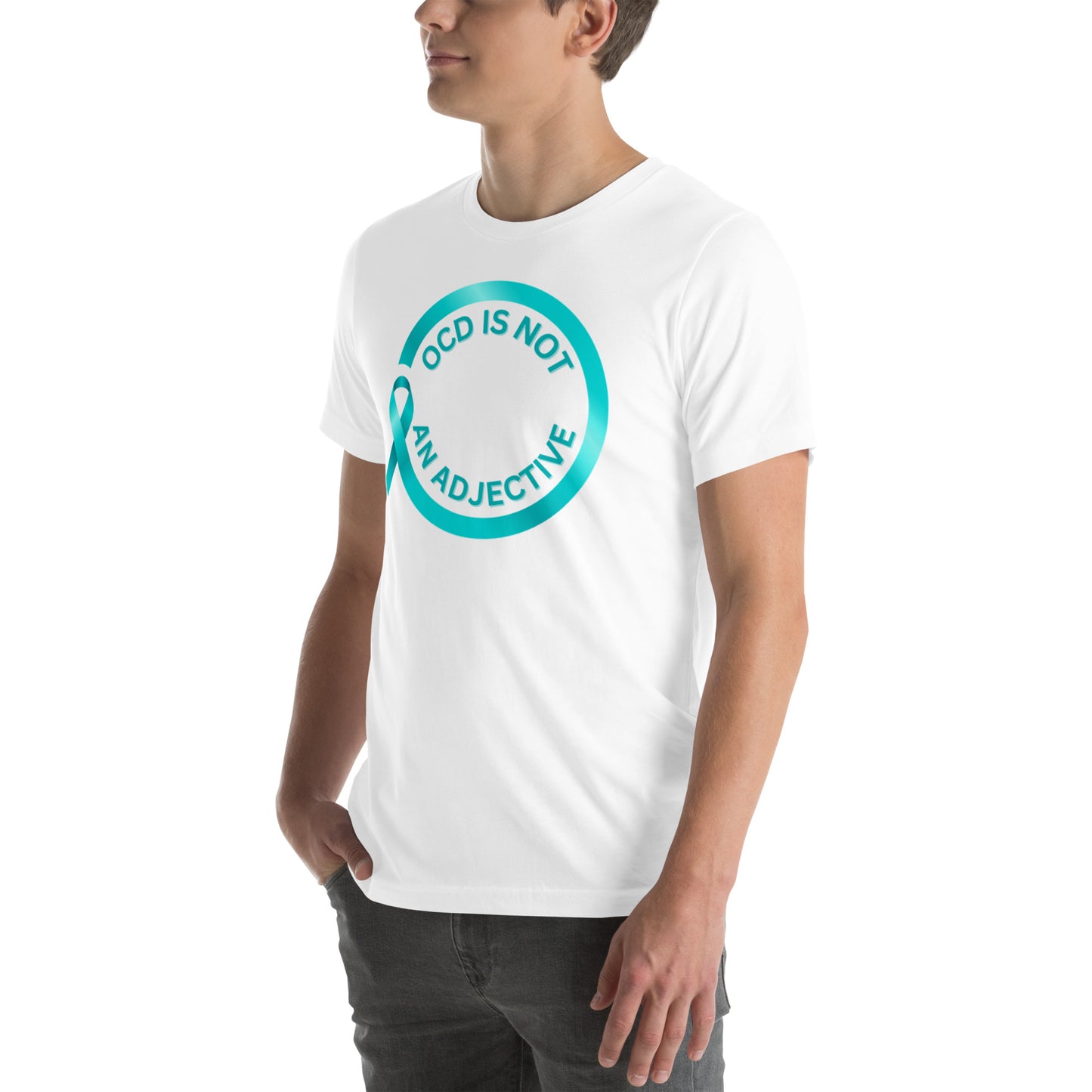 Wearing the "OCD Is Not An Adjective" t-shirt by NeuroNiche Design, a person stands with one hand in their pocket, showing off the circle of turquoise text on pre-shrunk fabric.